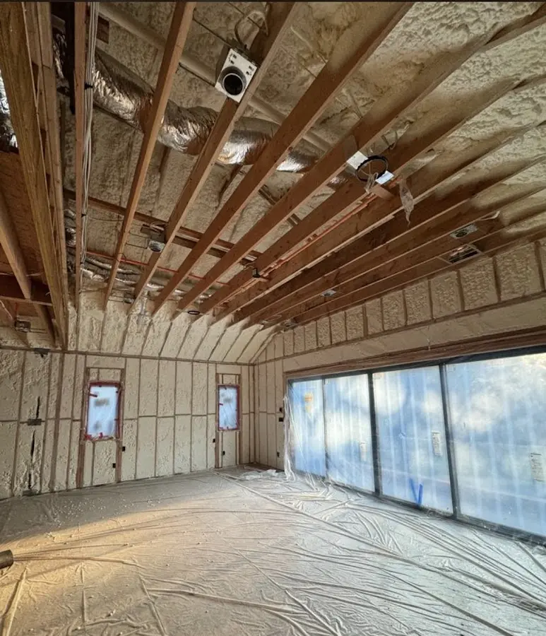 Interior walls and ceiling insulated with spray foam during new construction in Leicester